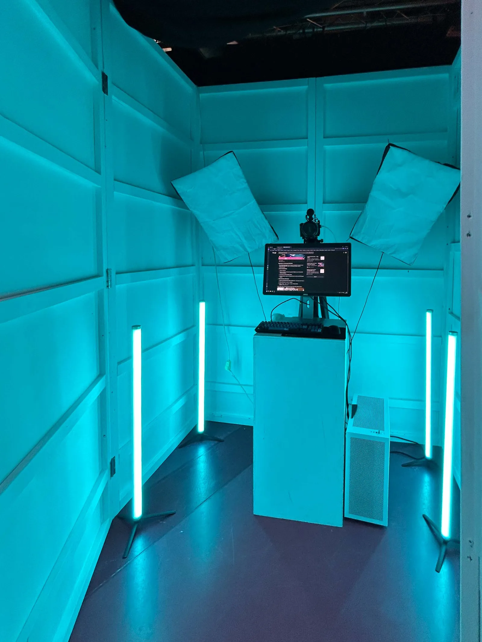 Interior of the Digital Self booth in bright blue light