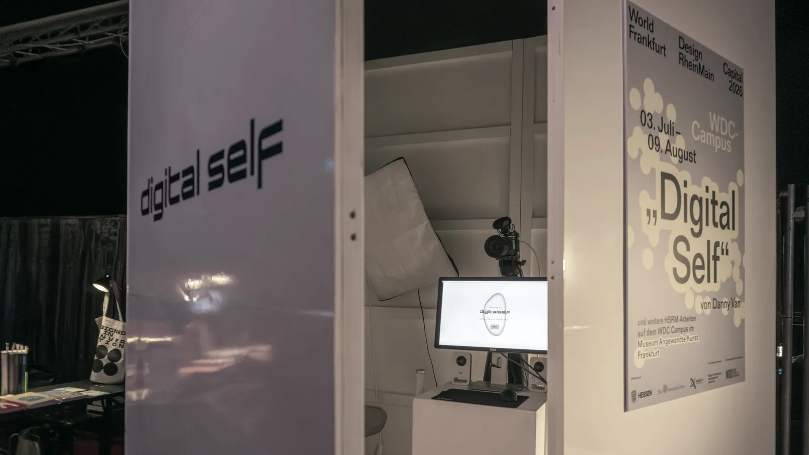View into the Digital Self booth with screen and camera