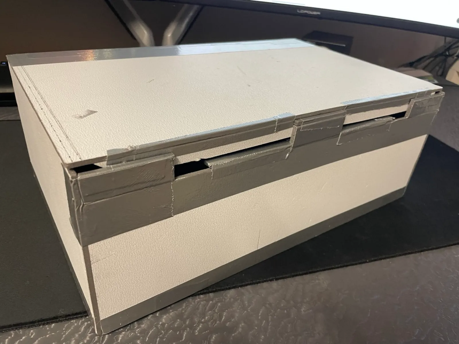 Prototype of the box made of grey cardboard